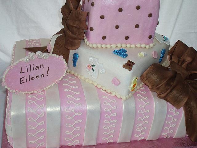 Baby Shower Tiered cake close up of colorful middle present with edible baby decorations