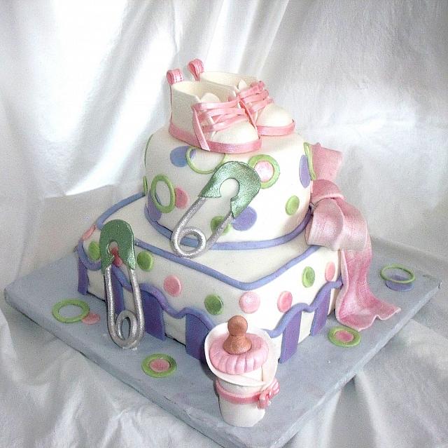 Whimsical Baby Shower Cake in Pink, Green, and Purple with Edible Gumpaste baby Shoes, Baby Bottle, and Safety Pins view 2