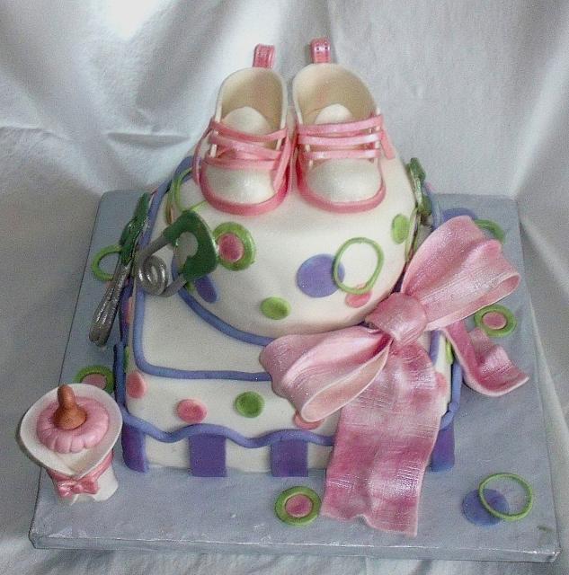 Whimsical Baby Shower Cake in Pink, Green, and Purple with Edible Gumpaste baby Shoes, Baby Bottle, and Safety Pins main view