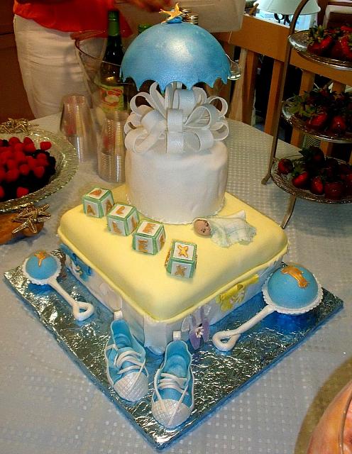 Baby Shower Cake For Boy with Sneakers, Baby Rattle, Umbrella, Baby Blocks, Baby Sleeping main view