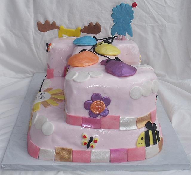 Moose And Zee Carved Number 1 First Birthday Cake with Whimsical Decorations back view