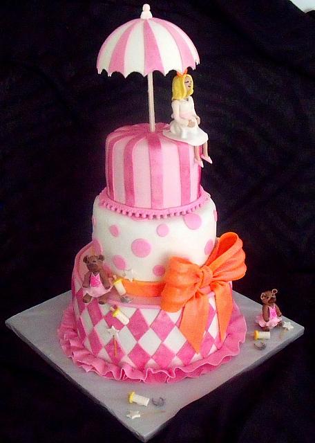 Baby Shower Fondant Cake with Mother Figurine, Umbrella, Princess Bears, Baby Bottles, Harlequin Design, Stripes, Dots, and Large Bow side view