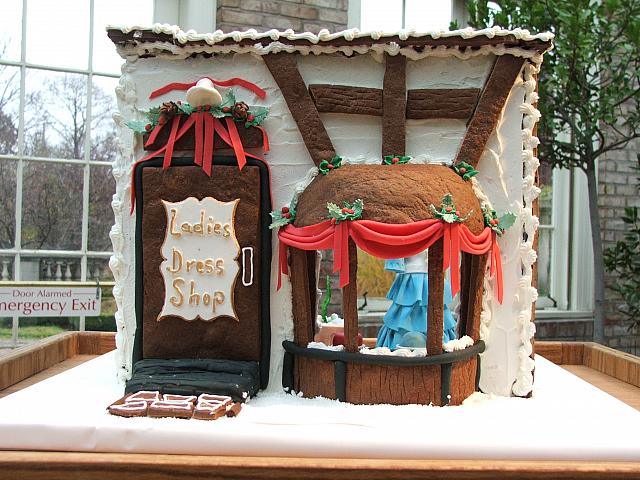 2008 George Eastman house gingerbread Ladies Dress Shop front view - notice the Christmas themed garlands have bell, pine cones, holly, ribbons