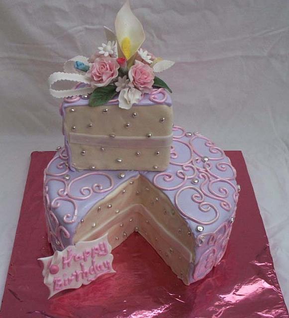 feminine birthday cake with single serving already cut and ...