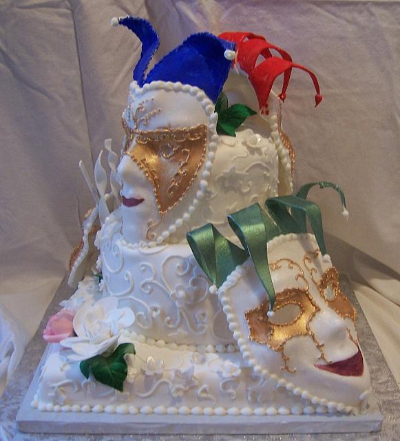 Fondant covered Mardi Gras Cake with Edible Gumpaste Masks and gumpaste roses, gardenias, flowers
