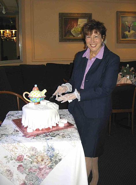 Eileen Perry ready to cut her future daughter-in-law's bridal shower cake