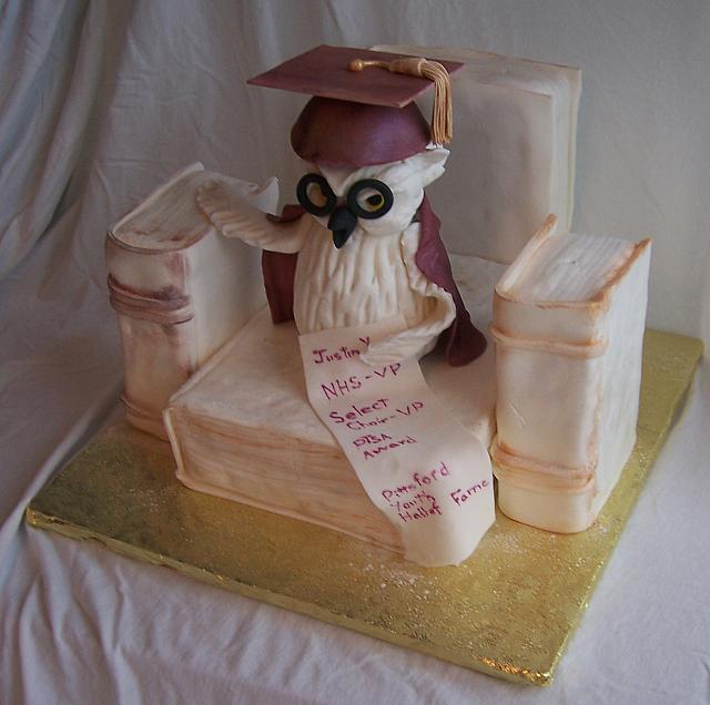 Graduation Cake With Owl And Books with clear view of Justin's list of accomplishments