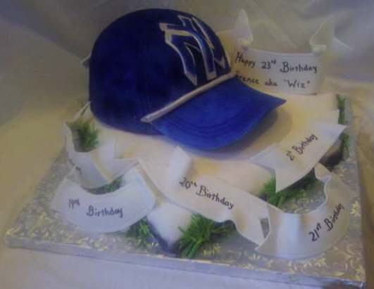 Yankees Baseball cap cake on homeplate cake with banners wishing happy birthday