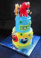 Sesame Street Elmo Jumping with Stars Circles Tiered Fondant Cake side view
