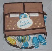 Louis Vuitton Baby Bag Cake with Gumpaste Duck, Baby Rings, Shoes, and Rings top view