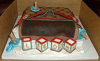 Gucci Baby Diaper Bag Cake With Edible Baby Blocks, Pacifiers, Baby Bottle front view