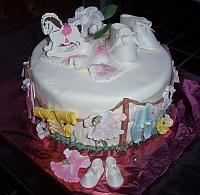Baby Shower cake with edible clothes