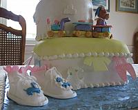 Another close up of the baby shower cake with baby shoes