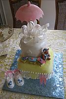Top view of the baby shower cake with baby shoes