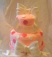 Pink Cake With Polka Dots and edible gumpaste White Bows and banner - Front view