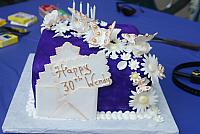Butterflies, flowers, envelope with card on purple cake