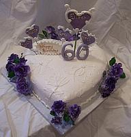 Heart shaped cake With Purple Roses and Victorian style purple sugarpaste hearts