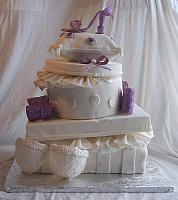 Metta's Bridal Shower cake of Stacked presents, purple shoe, purple bows, white gumpaste bra
