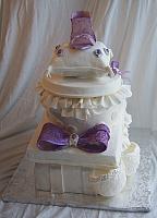 Side view of Metta's Bridal Shower cake of Stacked presents - notice the larbe bow detail