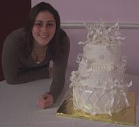 Marisa Astiz posing with White wedding cake
