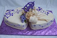 Purple heart wedding cake with gumpaste flowers and decorations
