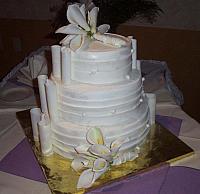 Side view of wedding cake that looks like bride's dress