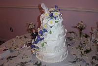 another view of wedding cake with lots of edible gumpaste flowers
