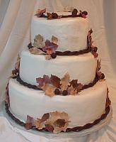 Fall Leaves Wedding Cake with Burgundy, Brown, and Beige Edible Gumpaste Leaves and Dark Chocolate Acorns main view