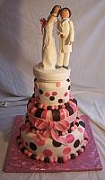Jessica Medina's whimsical wedding cake with handmade, edible bride and groom